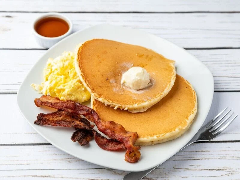 Pancake Plate - Fluffy pancakes served with eggs, bacon, and syrup